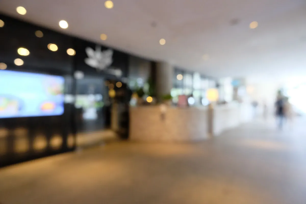 Blur focus of Long corridor in luxury condominium.The hallway is clean and luxurious.