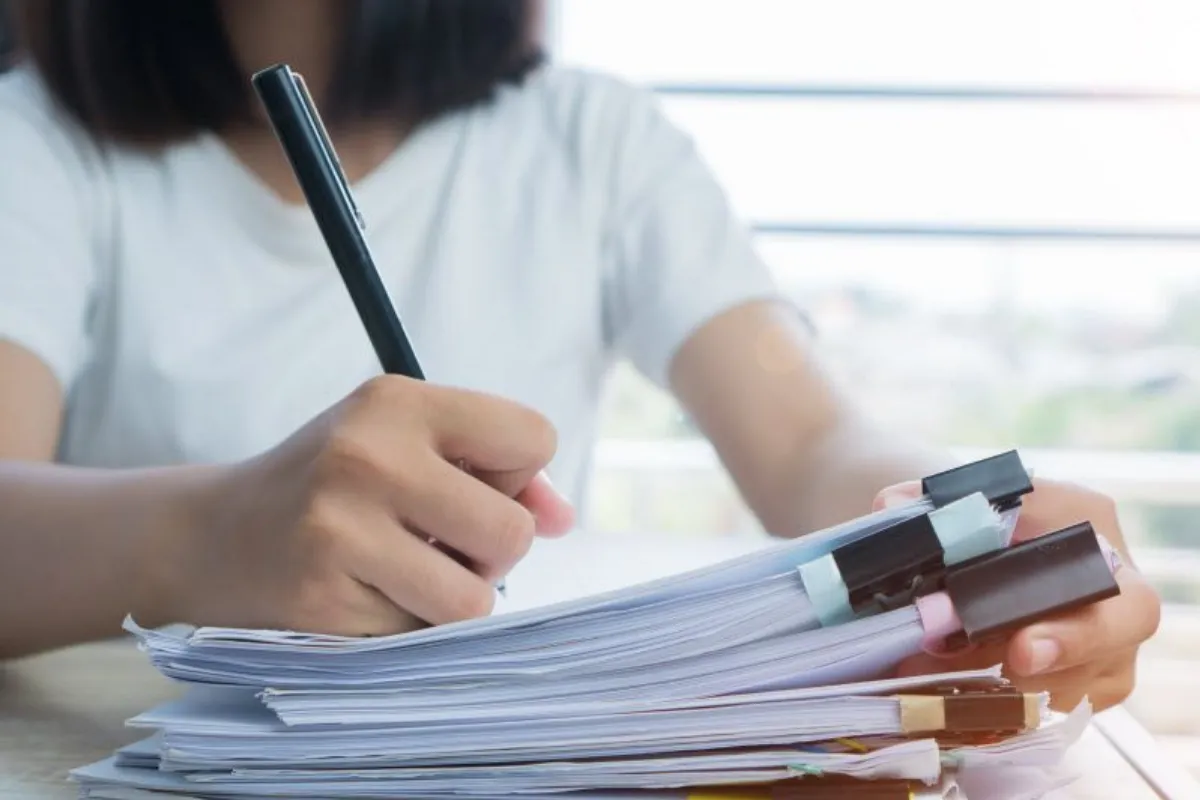 Business woman Manager checking and signing documents